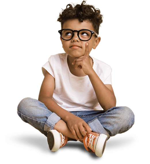 Boy with glasses (Bigger) Alano Power's Education Technology page photo of a little boy wearing glasses sitting on the floor with his legs crossed, he has his left finger on his face and he's looking up at the page heading